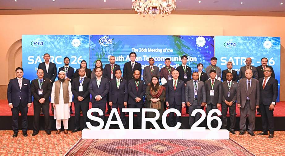 A group of people standing in front of a sign

Description automatically generated