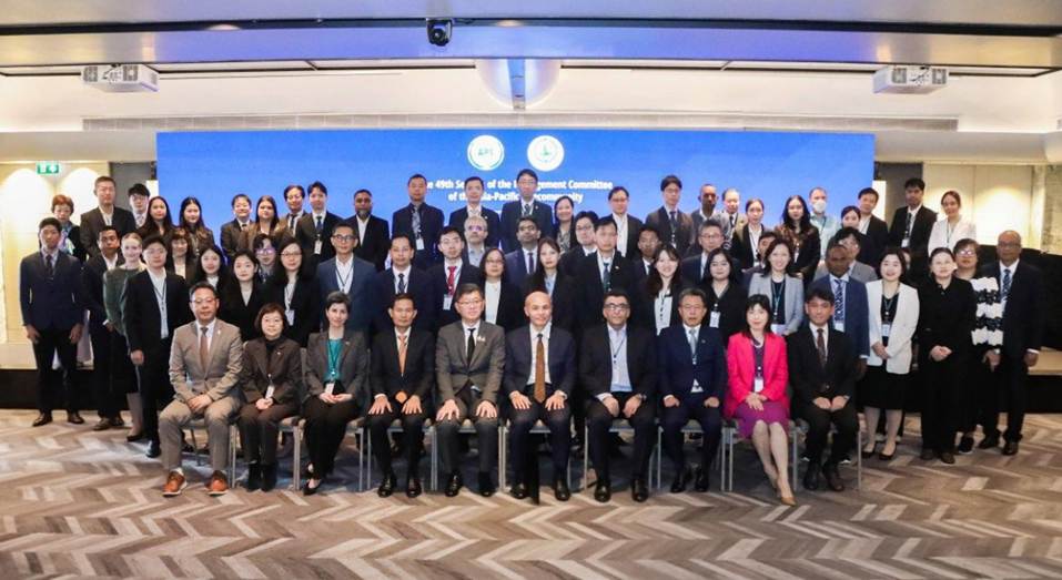 A group of people posing for a photo

Description automatically generated